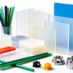 Assortment of high-performance plastic materials (PEEK, PTFE) and custom-machined corrosion-resistant valves and fittings