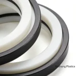 Close-up of wear-resistant sealing components made of PEEK and PTFE from Viethung Plastics.