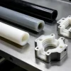 Custom CNC machined high-performance plastic parts including PEEK and PTFE rods and manifolds.