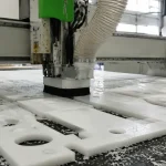 High-precision CNC routing machine cutting custom polypropylene PP plastic sheets in a Vietnam OEM manufacturing facility to minimize material waste.